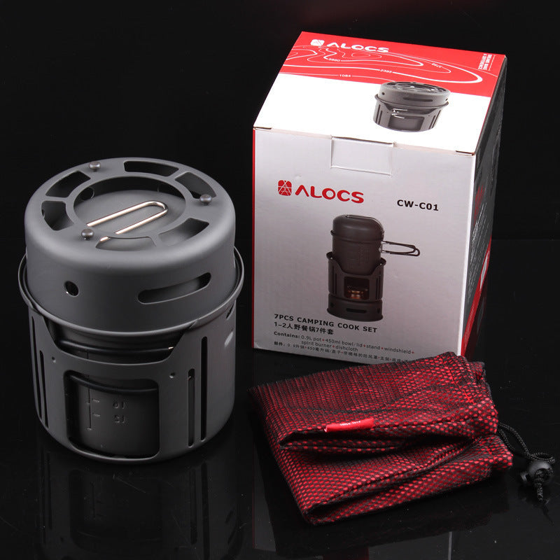 Small outdoor camping cookware set with compact pots, pan, and utensils for outdoor cooking