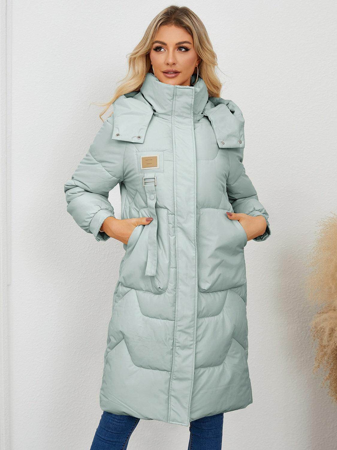 Long sleeve longline hooded winter coat for women, black, with a relaxed fit and cozy fabric from Trendsi.