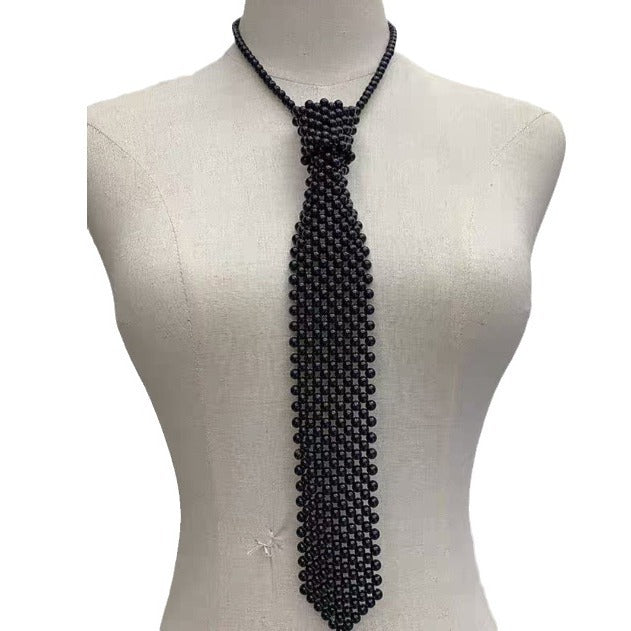 Pearl tie body chain with hollow-out handmade retro design, shown draped across the torso