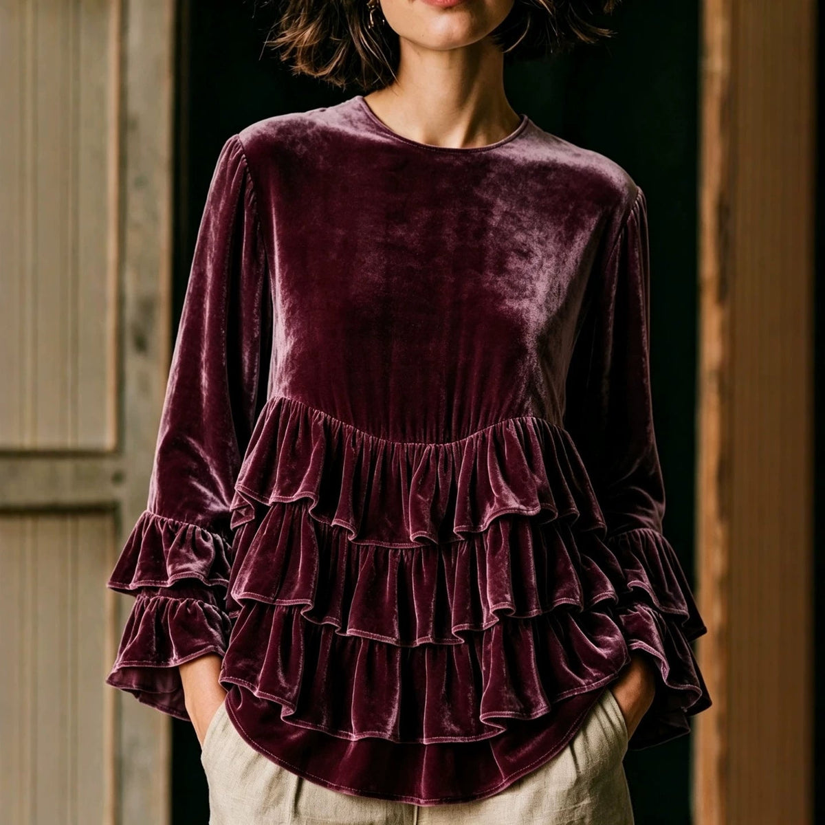 Women's long-sleeve solid-color crew-neck casual loose-fit top with ruffle trim, front view