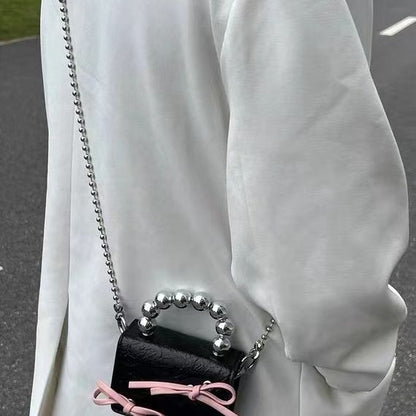 Textured cute bow mini chain handbag with compact design and decorative bow detail
