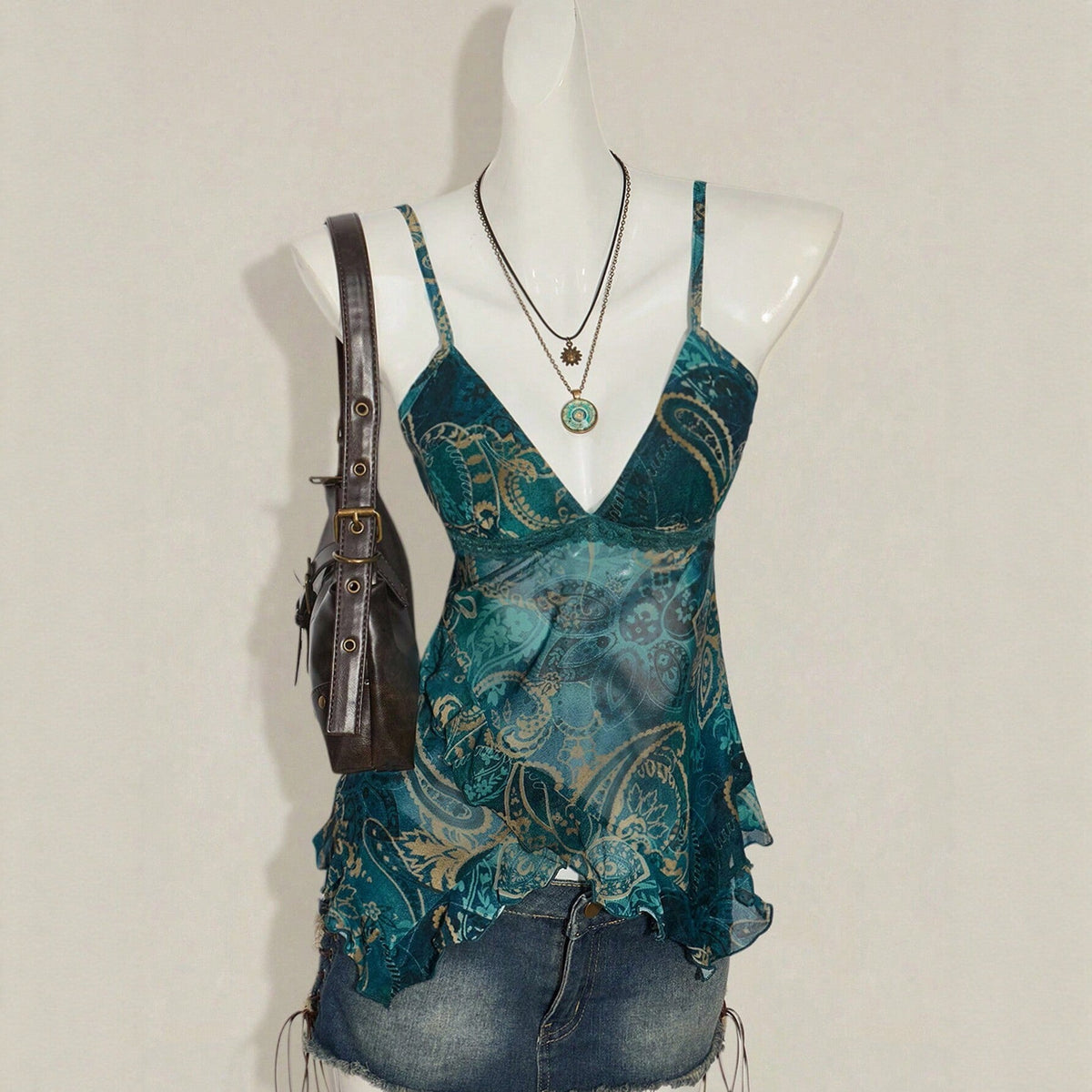 Floral-print mesh top with a figure-flattering silhouette and sheer long sleeves