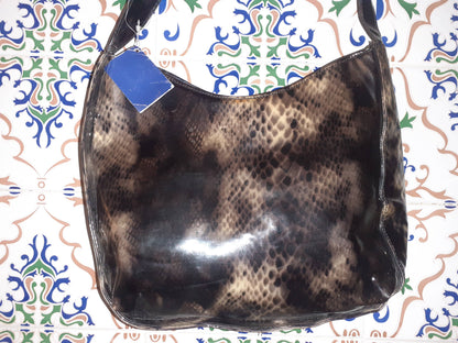 Handmade women's shoulder bag with handles, featuring a stylish and durable design perfect for everyday use.