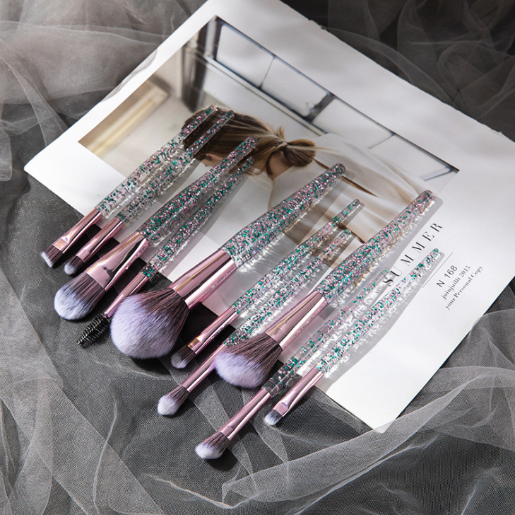 Set of 10 essential makeup brushes from BACKUPMYFILESNOW® in various sizes and shapes for applying foundation, blush, and eyeshadow.
