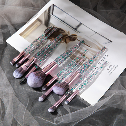 Set of 10 essential makeup brushes from BACKUPMYFILESNOW® in various sizes and shapes for applying foundation, blush, and eyeshadow.