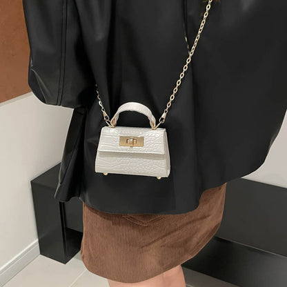 Casual small square handbag with shoulder strap in a simple structured design