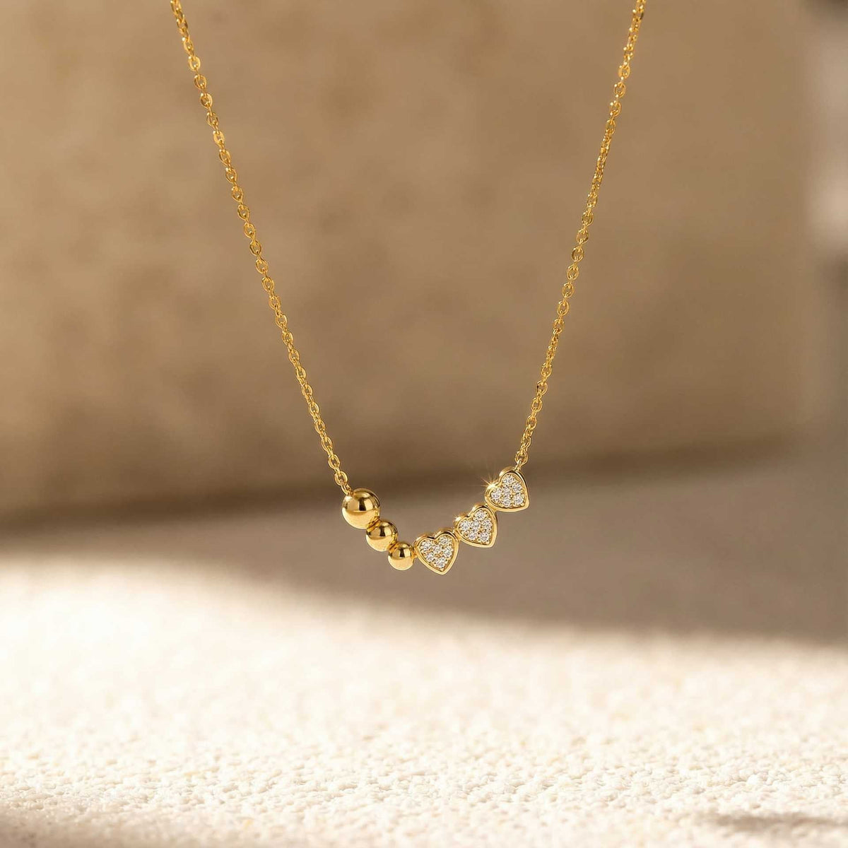 Multi-layered heart-shaped diamond necklace with delicate layered chains