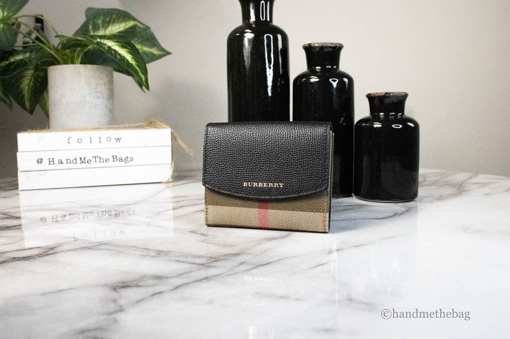 Burberry Luna black leather coin pouch wallet with house check pattern, featuring compact design and branded details.
