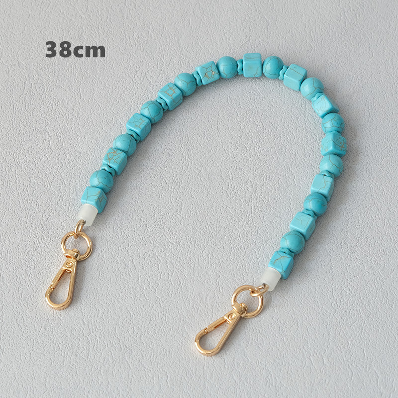 Vintage turquoise resin bag chain accessory close-up
