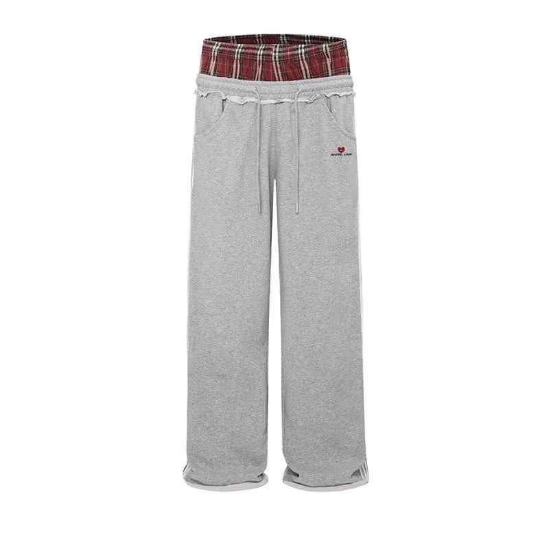 Retro striped embroidered athletic shorts in red, white, and blue with elastic waistband