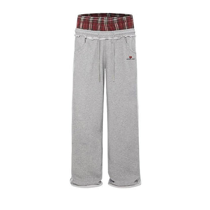 Retro striped embroidered athletic shorts in red, white, and blue with elastic waistband