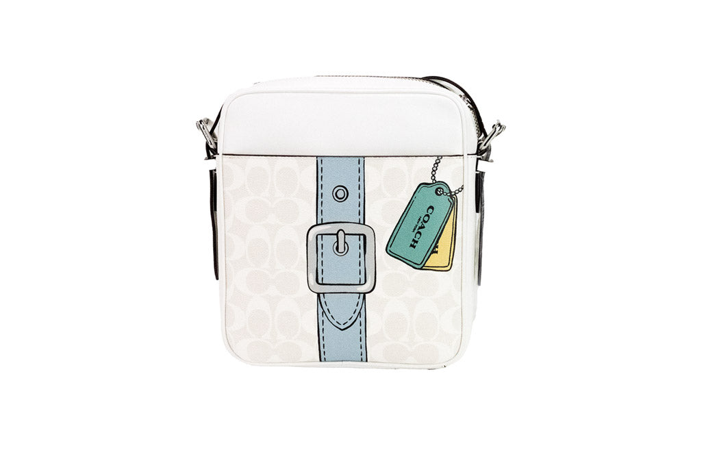 Coach Hudson 21 Medium Chalk Trompe L'oeil print handbag with top handles and logo details, showcasing its stylish design.