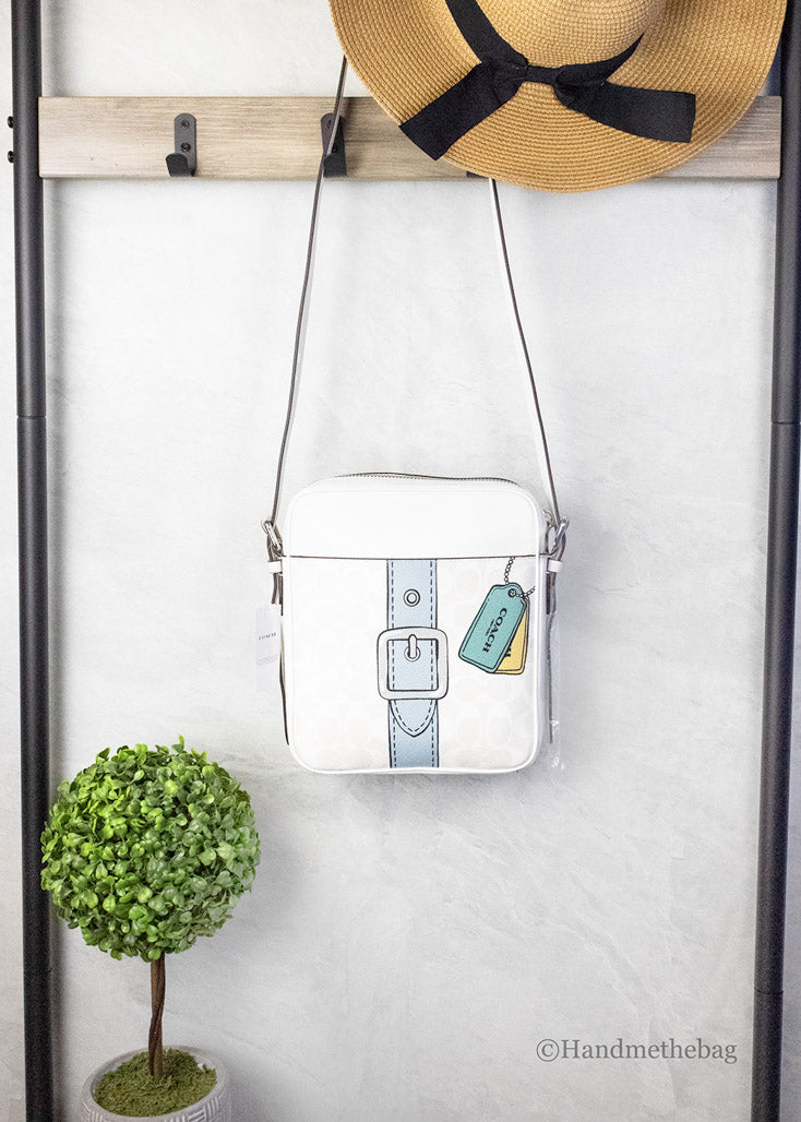 Coach Hudson 21 medium chalk Trompe L'oeil print handbag with structured silhouette and top handles.