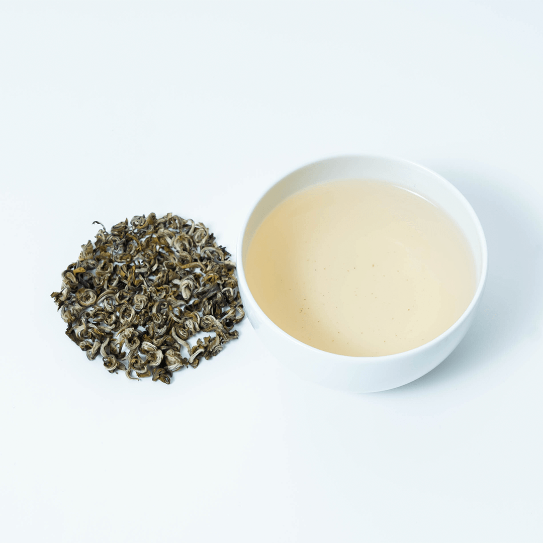 Organic Farmers' Green Tea by Nepal Tea, fresh green tea leaves with a lush, vibrant appearance suitable for brewing.
