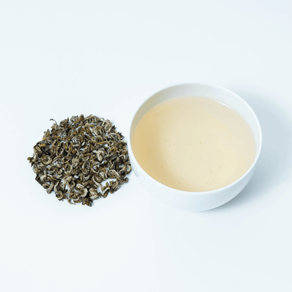Organic Farmers' Green Tea by Nepal Tea, fresh green tea leaves with a lush, vibrant appearance suitable for brewing.