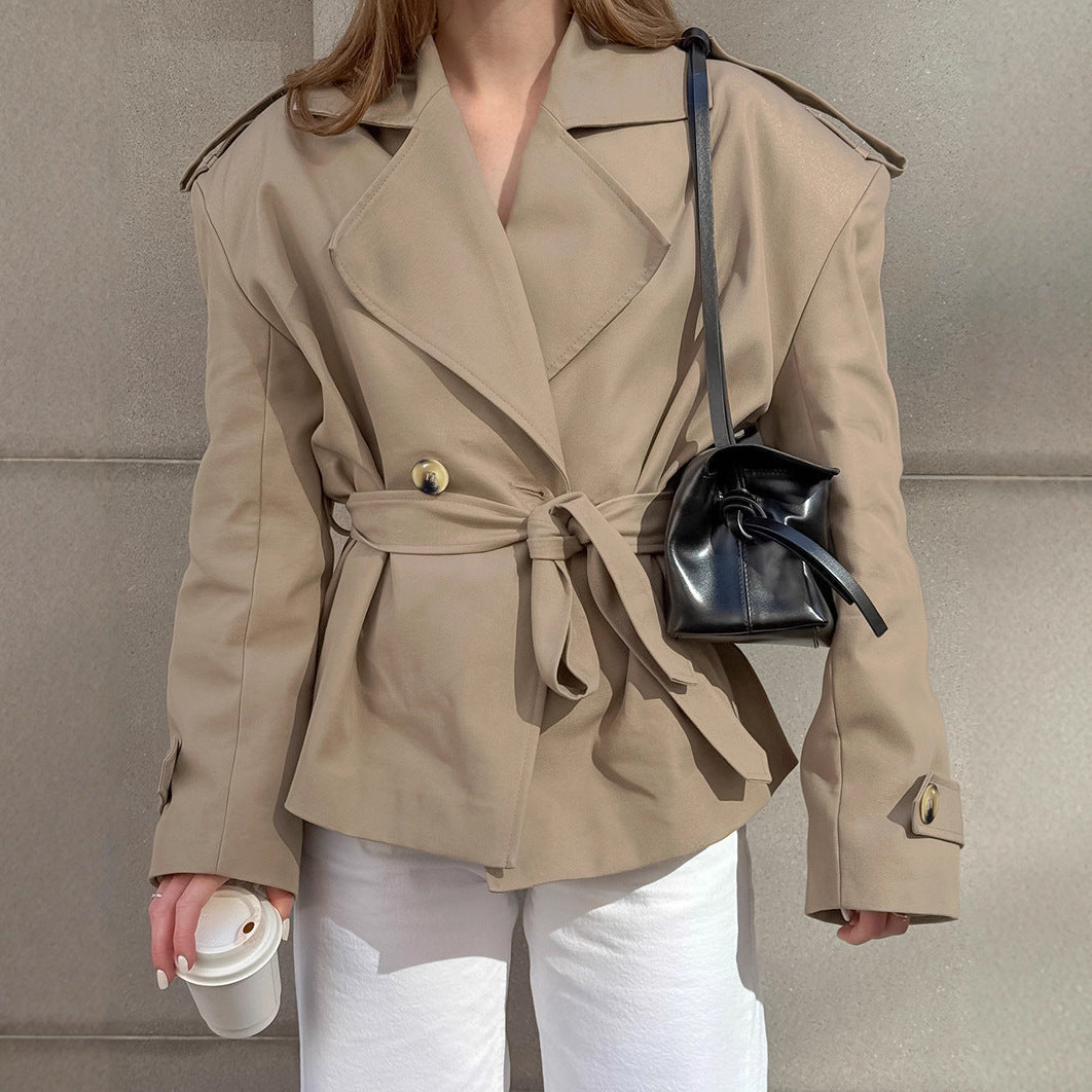 Women's khaki mid-length trench coat with lace-up waist and casual fit, front view
