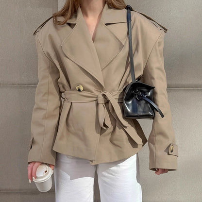 Women's khaki mid-length trench coat with lace-up waist and casual fit, front view