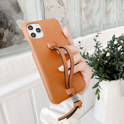 Three Bread leather wrist strap phone case, showing the case design and attached wrist strap