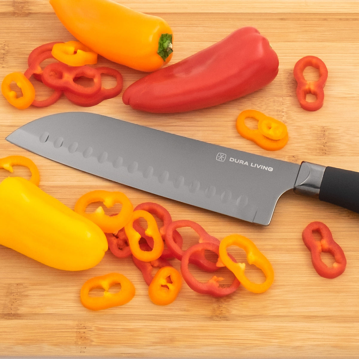 Black Titan 7-inch Santoku Knife from Dura Living with a sharp stainless steel blade and ergonomic handle.