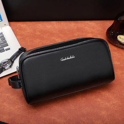 Men's leather clutch wallet handbag in black with zippered compartments and wrist strap
