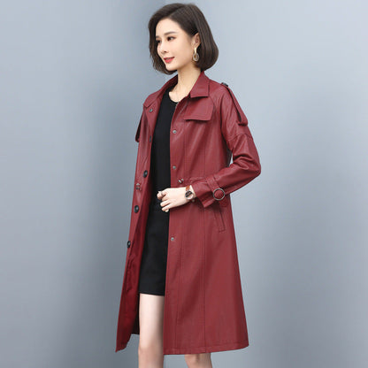 Women’s leather trench coat with turn-down collar, drawstring waist, solid color, and long sheepskin design