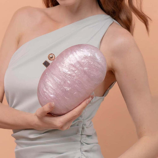 Women's oval pearlescent fashion shoulder bag with a glossy finish and structured silhouette
