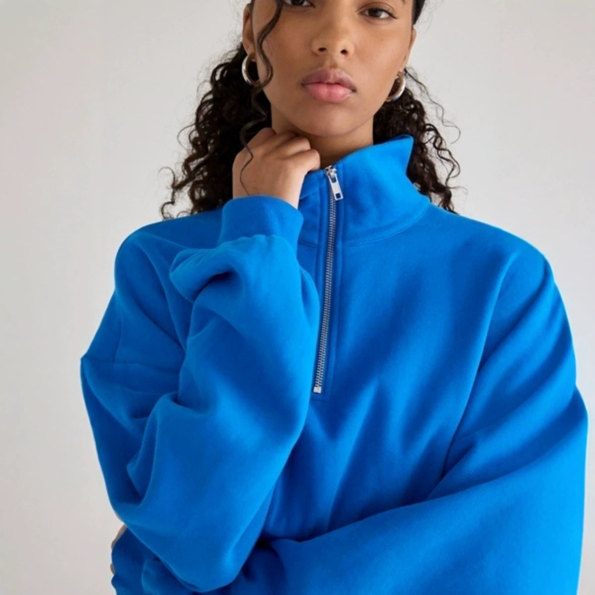 Women's loose-fit half-zip lapel sweatshirt with puff sleeves and short pullover design