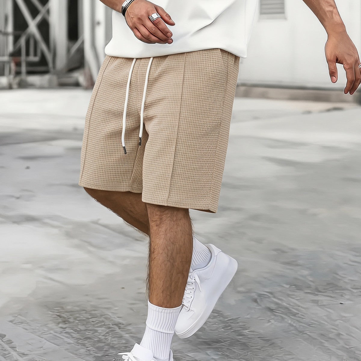 Men's drawstring loose-fit athletic shorts in a relaxed design with an adjustable waistband