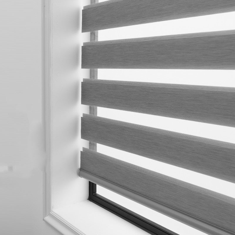 Soft gauze semi-shading electric zebra rolling curtain in a roll-up design, viewed from the front
