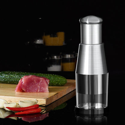 Manual garlic crusher and onion chopper vegetable press in compact kitchen gadget design
