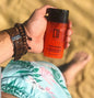 BACKUPMYFILESNOW® Mandarin and Aloe Facial Scrub for Him with textured surface and natural ingredients visible in the container.