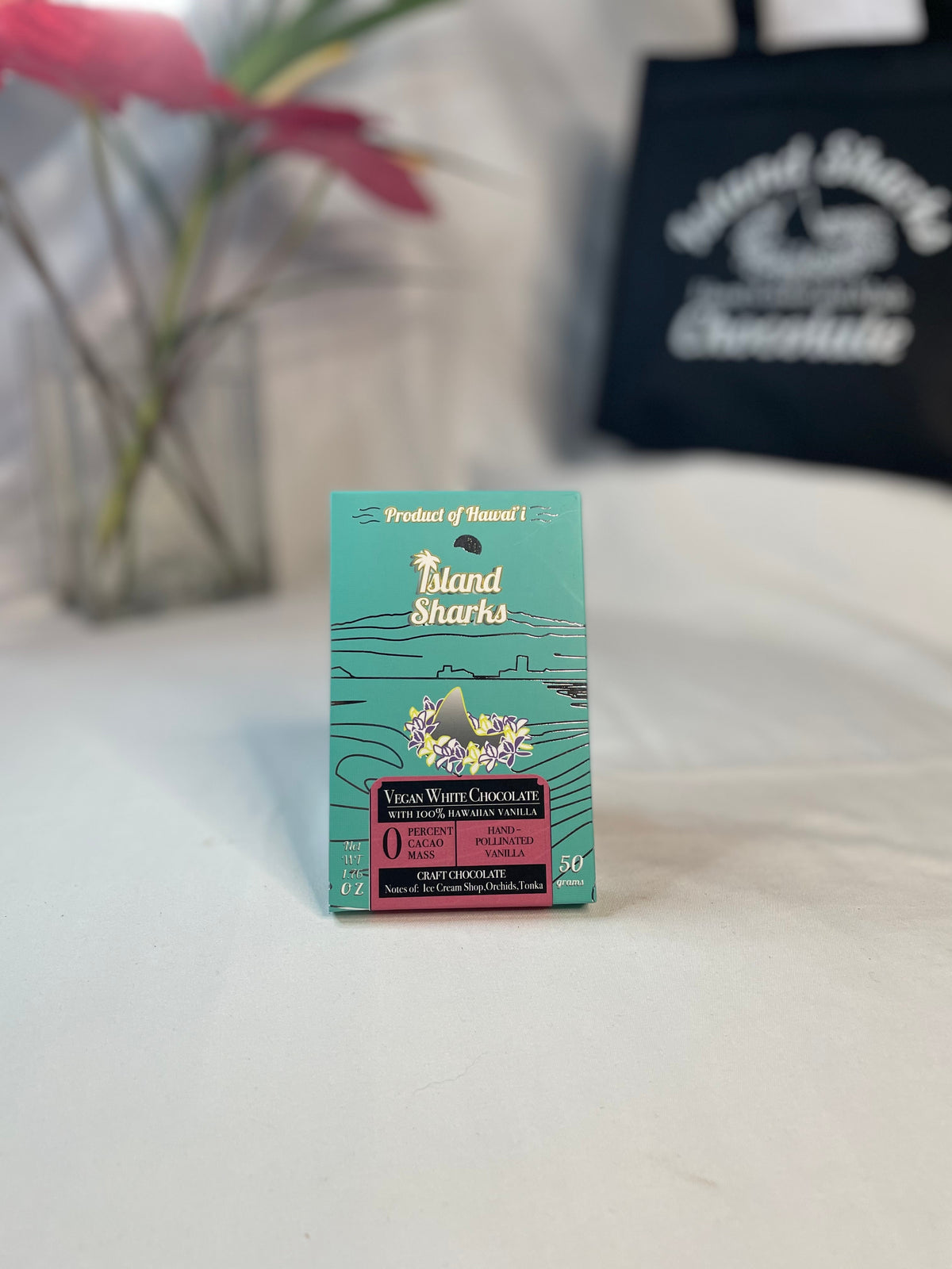 Six Island Sharks Chocolate Hawai'i Inclusion Bars in a variety of flavors, showcasing colorful packaging and assorted chocolate treats.