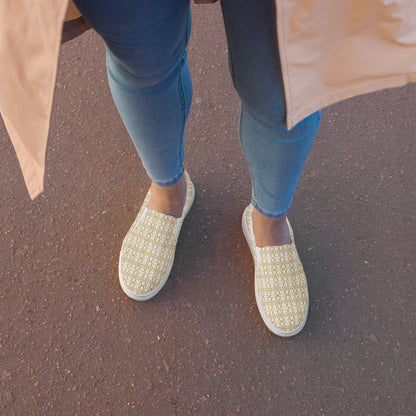White women's slip-on shoes in waterproof canvas with an anatomical sole by Atelier Evezet Arapakou, shown from a side angle.