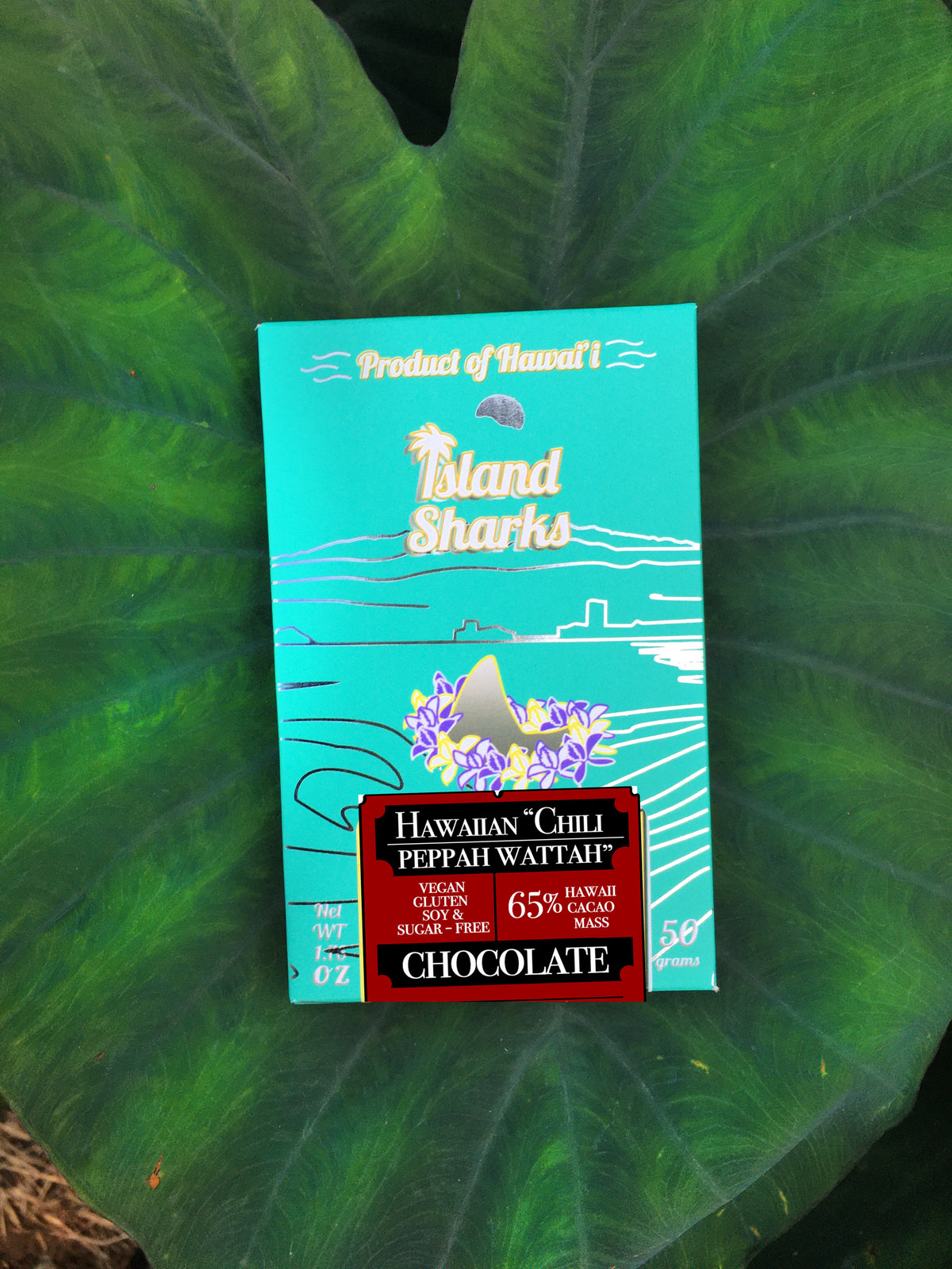 Hawaiian Chili Peppah Watah Chocolate Bar from ISLAND SHARKS CHOCOLATE, featuring bean-to-bar dark chocolate with chili pepper and cacao tea.