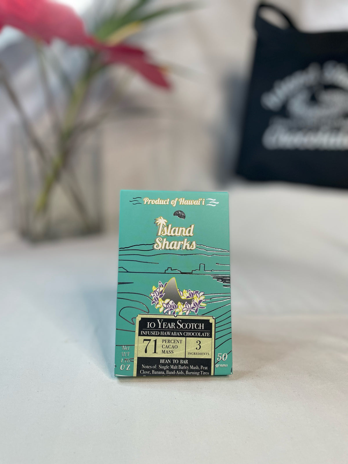 Six ISLAND SHARKS CHOCOLATE Hawai'i Inclusion Bars in assorted flavors, showing colorful packaging and variety of chocolate treats.