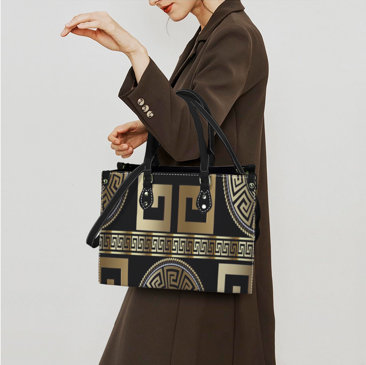 Women's handbag with original Greek design, Atelier Evezet Arapakou, featuring intricate patterns and a stylish purse shape.