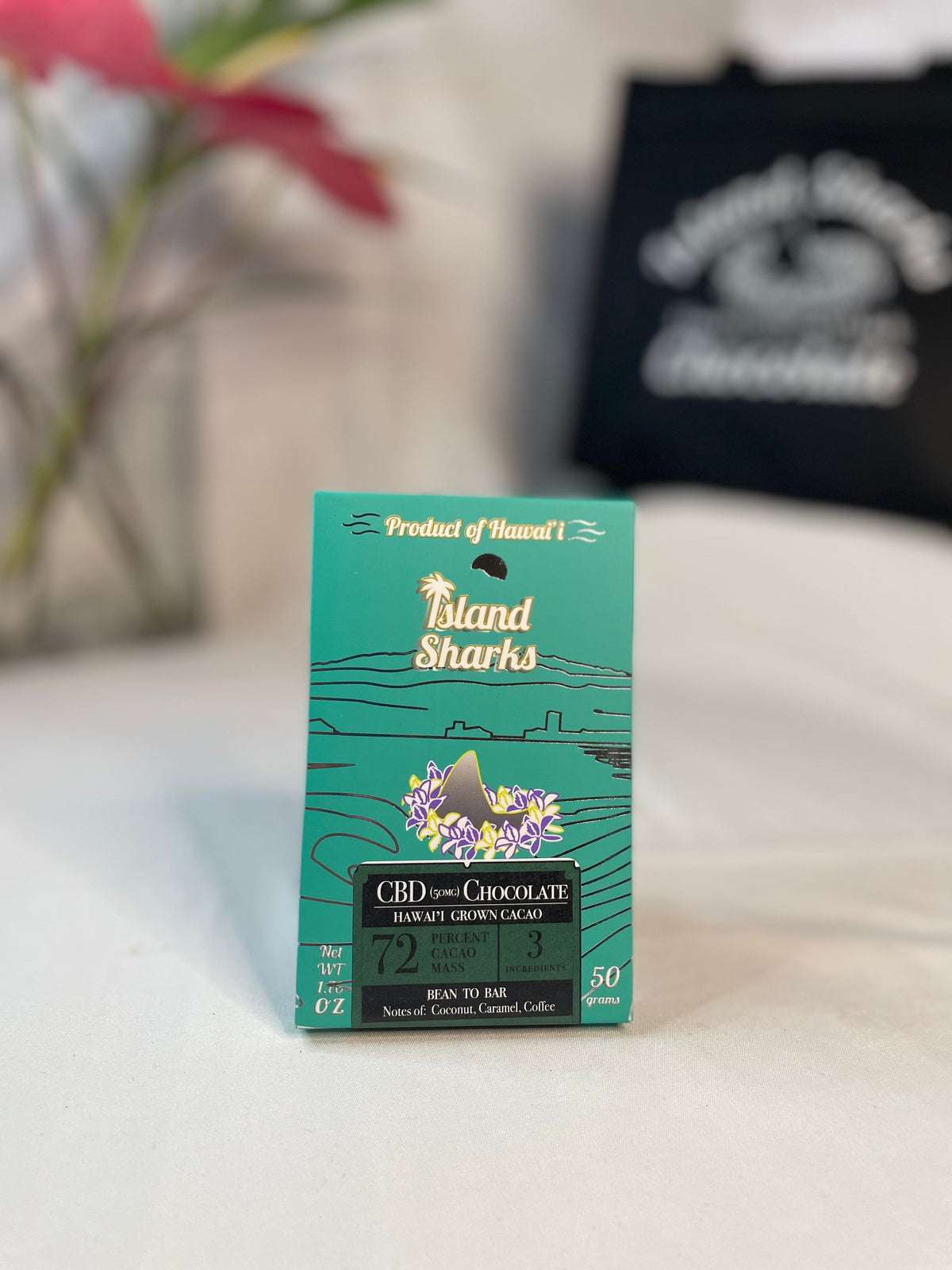 Six Island Sharks Chocolate Hawai'i Inclusion Bars in assorted flavors, shown in a colorful 6-pack display.