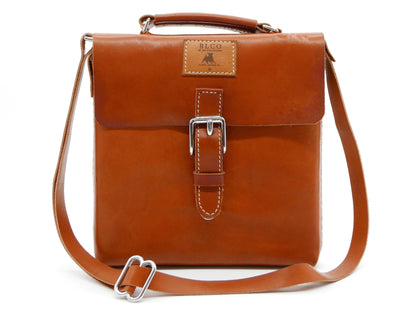 BLCO® Satchel Mini by Bueno Leather Co., a compact handcrafted leather travel pouch with a sleek design and sturdy strap.