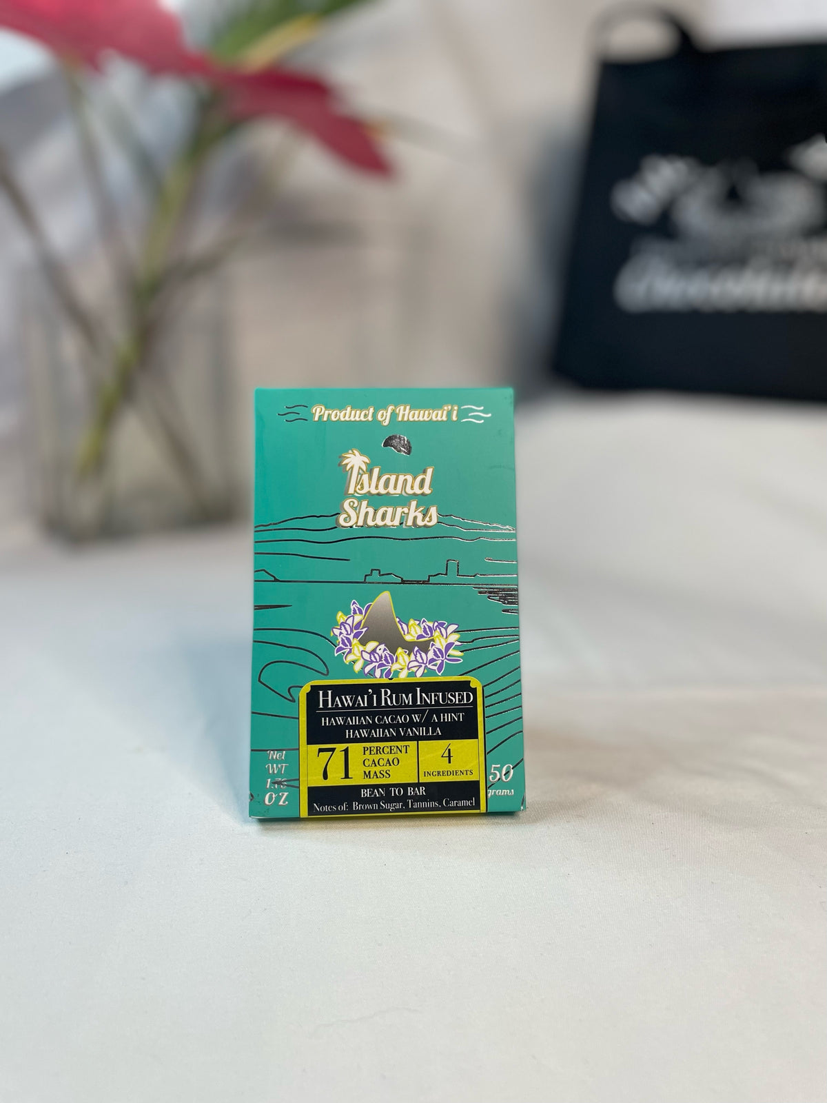 Six ISLAND SHARKS CHOCOLATE Hawai'i Inclusion Bars in assorted flavors, with colorful packaging and tropical design.