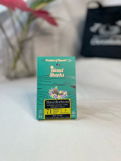Six ISLAND SHARKS CHOCOLATE Hawai'i Inclusion Bars in assorted flavors, with colorful packaging and tropical design.