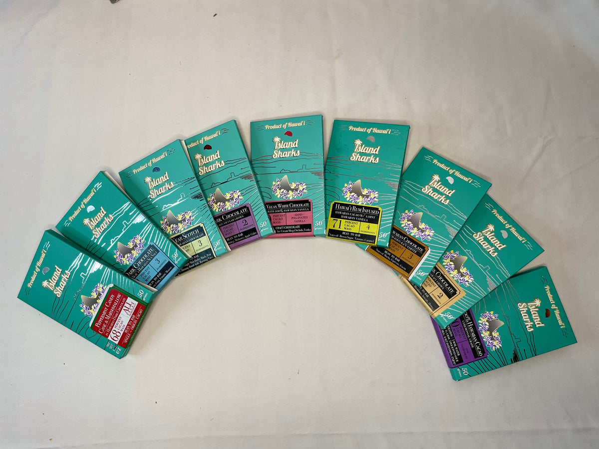 Six Island Sharks Chocolate Hawai'i Inclusion Bars in assorted flavors, displayed together in a colorful pack.