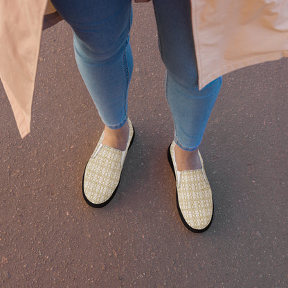 White women's slip-on shoes from Atelier Evezet Arapakou with waterproof canvas and anatomical sole, designed for comfort.