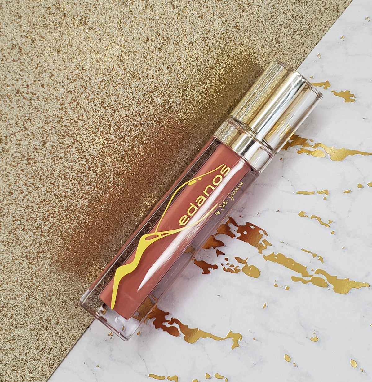 Medanos Lipgloss Collection #10 by BACKUPMYFILESNOW® featuring glossy lip glosses in various shades, displayed in a sleek collection.
