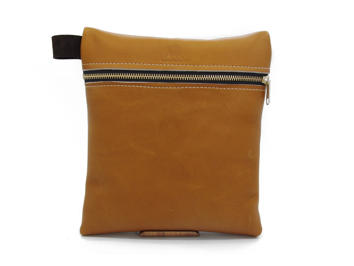 BLCO® Durable handcrafted leather travel pouch by Bueno Leather Co. with secure zipper closure and rustic brown finish.