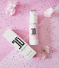 BACKUPMYFILESNOW® makeup primer tube showing smooth, clear formula ready for application on skin.