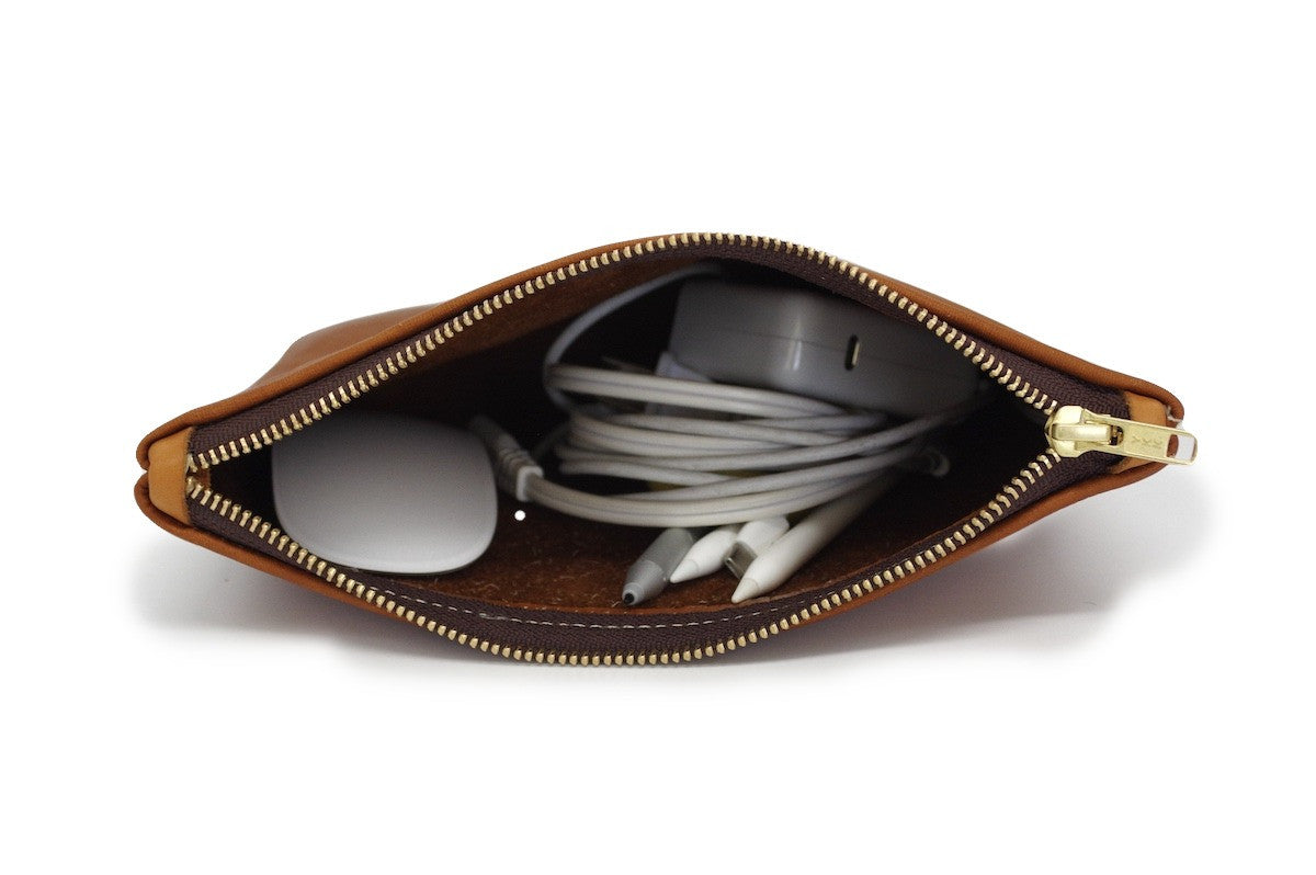 Durable handcrafted leather travel pouch by Bueno Leather Co. with multiple compartments and rustic finish.