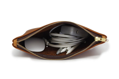 Durable handcrafted leather travel pouch by Bueno Leather Co. with multiple compartments and rustic finish.