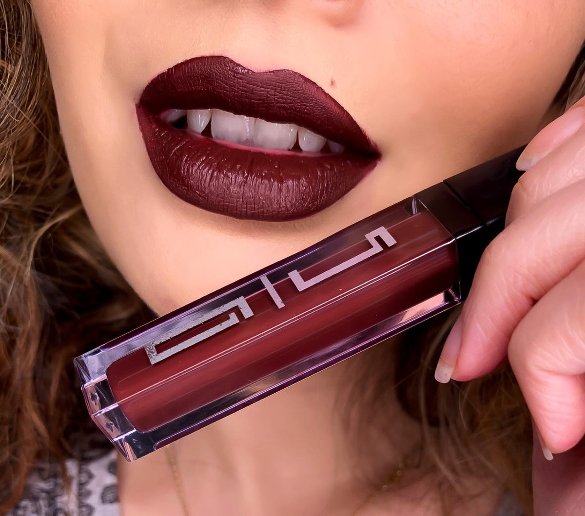 BACKUPMYFILESNOW® Matte Liquid Lipstick 35 in a sleek tube, showcasing the deep matte finish and vibrant color of the lipstick.