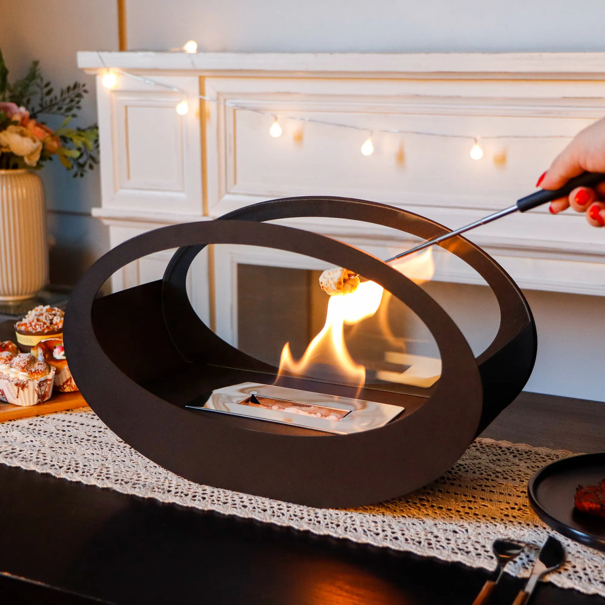 Black metal tabletop fireplace by JHY DESIGN featuring gel and ethanol fire options, with a sleek 16x9.5-inch design.