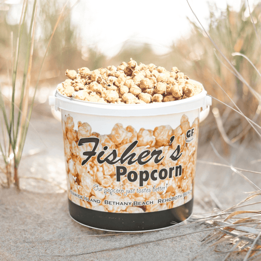 Fisher's Popcorn caramel popcorn tub, 1.2-gallon size, with a clear view of the tub filled with buttery caramel popcorn.